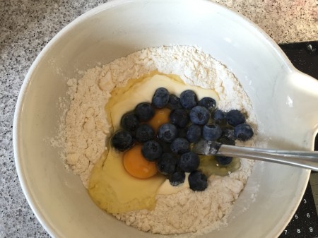 stir in eggs, milk and blueberries